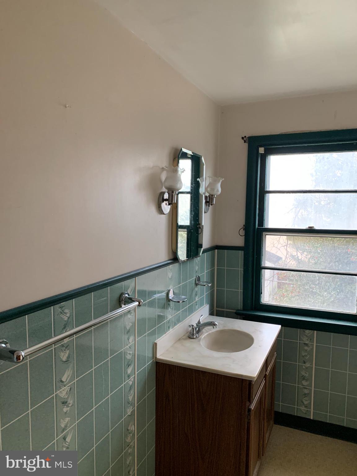 1231 High Street Lancaster, PA 17603 - Photo 14 of 16 a bathroom with a sink and a mirror