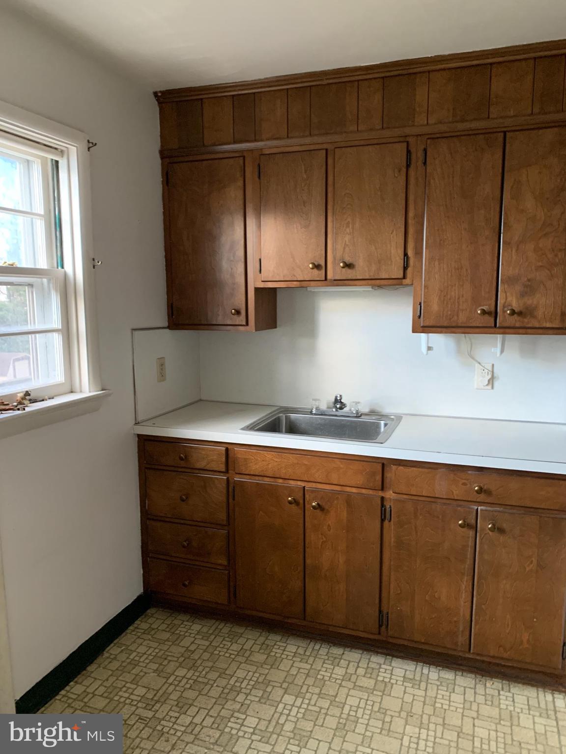 1231 High Street Lancaster, PA 17603 - Photo 6 of 16 a kitchen with a sink and cabinets