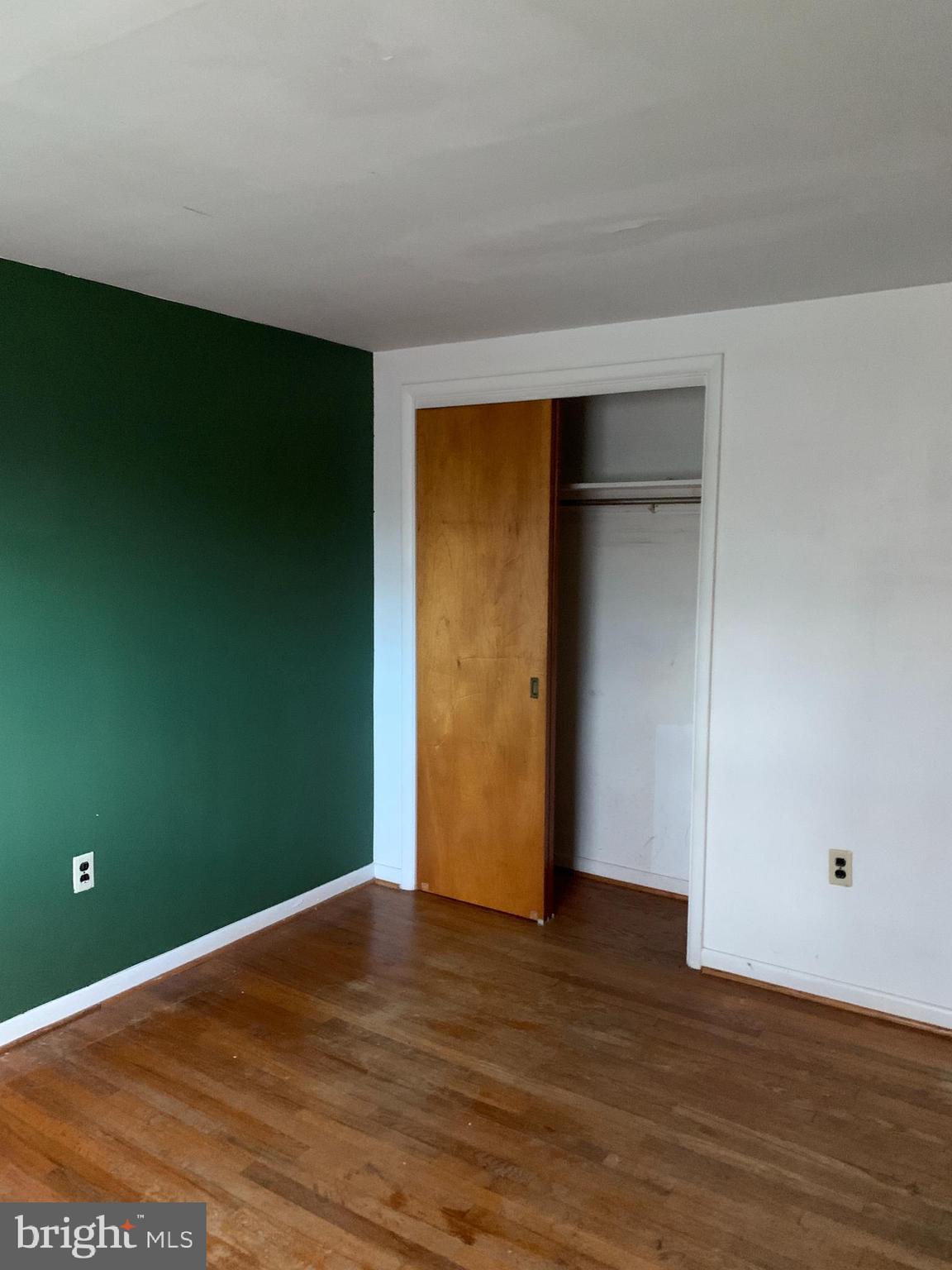 1231 High Street Lancaster, PA 17603 - Photo 9 of 16 a view of an empty room with wooden floor and closet
