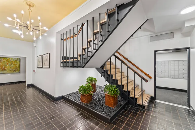 a room with stairs and wooden floor