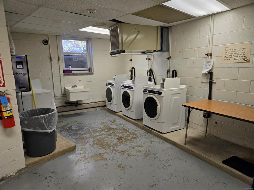 119 Crooked Hill Road, Unit 103 Pearl River, NY 10965 - Photo 15 of 16 Community Laundry area featuring sink and washing machine and clothes dryer