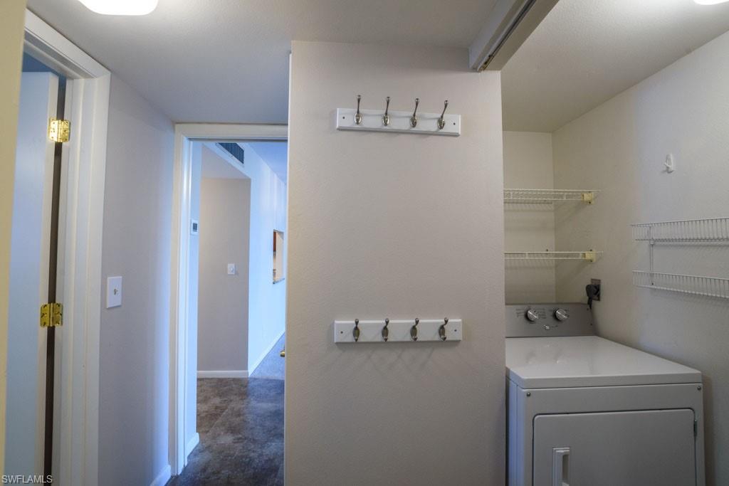 1 High Point Circle West, Unit 203 Naples, FL 34103 - Photo 15 of 31 a bathroom with a sink and cabinets