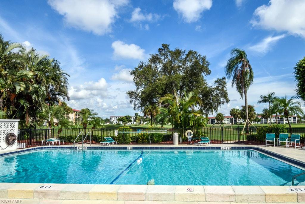 1 High Point Circle West, Unit 203 Naples, FL 34103 - Photo 18 of 31 a view of swimming pool