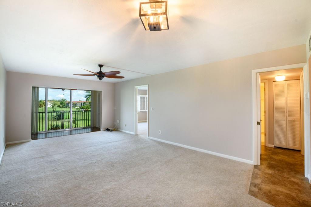 1 High Point Circle West, Unit 203 Naples, FL 34103 - Photo 6 of 31 a view of an empty room with a window