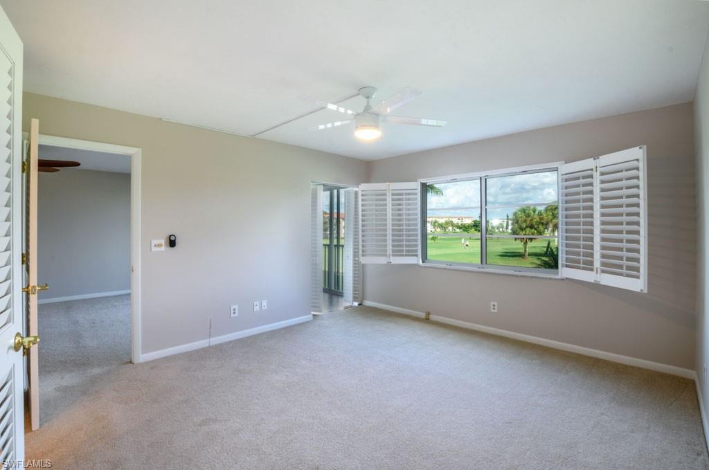 1 High Point Circle West, Unit 203 Naples, FL 34103 - Photo 8 of 31 a view of an empty room with a window