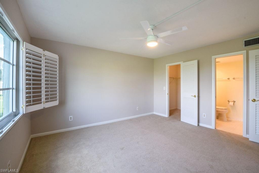 1 High Point Circle West, Unit 203 Naples, FL 34103 - Photo 9 of 31 a view of an empty room with a window