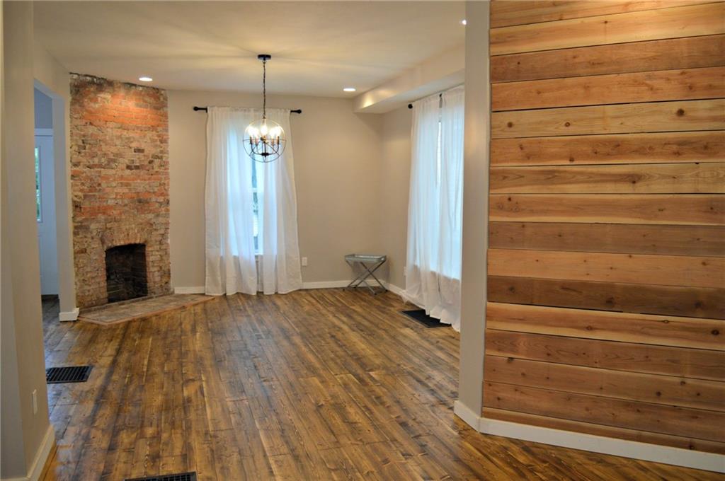 223 Mercer Street Butler, PA 16001 - Photo 2 of 21 New Hardwood Floors, recessed lighting, exposed brick chimney