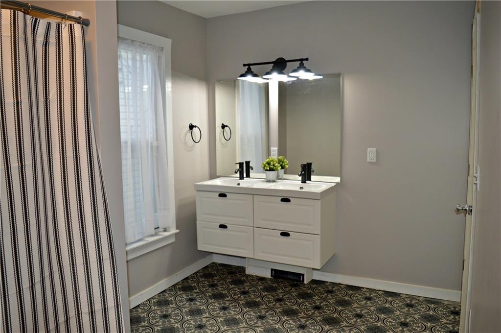 223 Mercer Street Butler, PA 16001 - Photo 13 of 21 Floating vanity with double bowl sink and new fixtures.