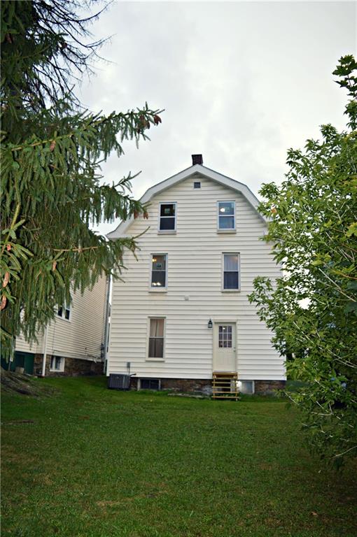 223 Mercer Street Butler, PA 16001 - Photo 21 of 21 Rear of house with yard. New roof and chimney re-pointed. New AC unit.