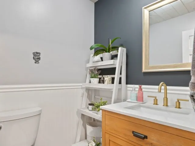 a room with a sink and a washer dryer