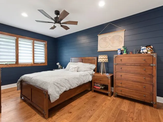 a bedroom with a bed and window