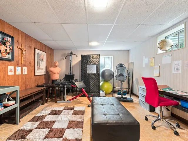 a view of a workspace with furniture