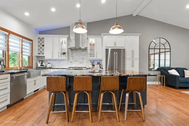 a kitchen with lots of counter space and dining table