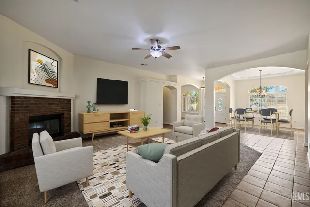 a living room with furniture and a fireplace