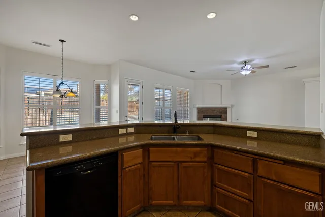 a kitchen with a sink and a stove