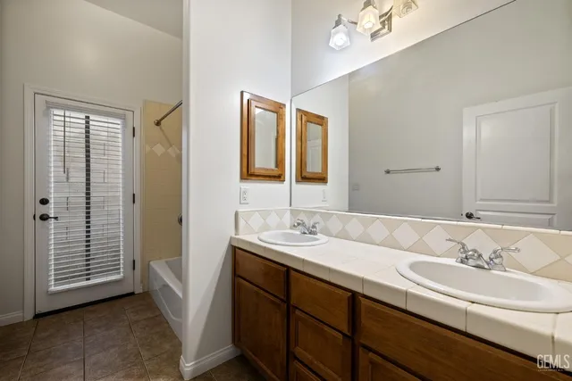 a view of a workspace with furniture and a potted plant