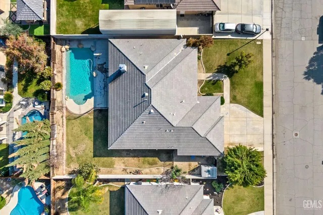 an aerial view of residential houses with outdoor space and parking space