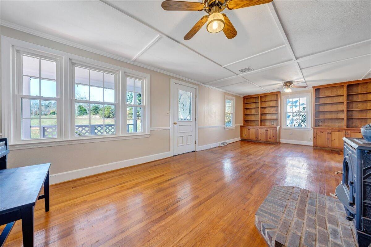 460 Thompson Ridge Road Ferrum, VA 24088 - Photo 11 of 48 a view of an empty room with a window and wooden floor