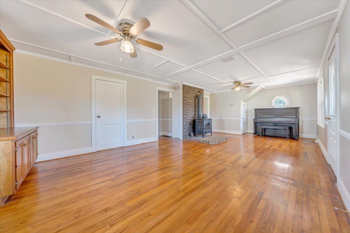 460 Thompson Ridge Road Ferrum, VA 24088 - Photo 12 of 48 a view of empty room with wooden floor and ceiling fan