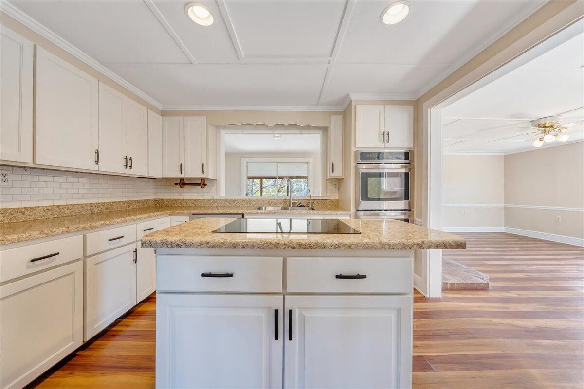 460 Thompson Ridge Road Ferrum, VA 24088 - Photo 13 of 48 a kitchen with granite countertop a sink and cabinets