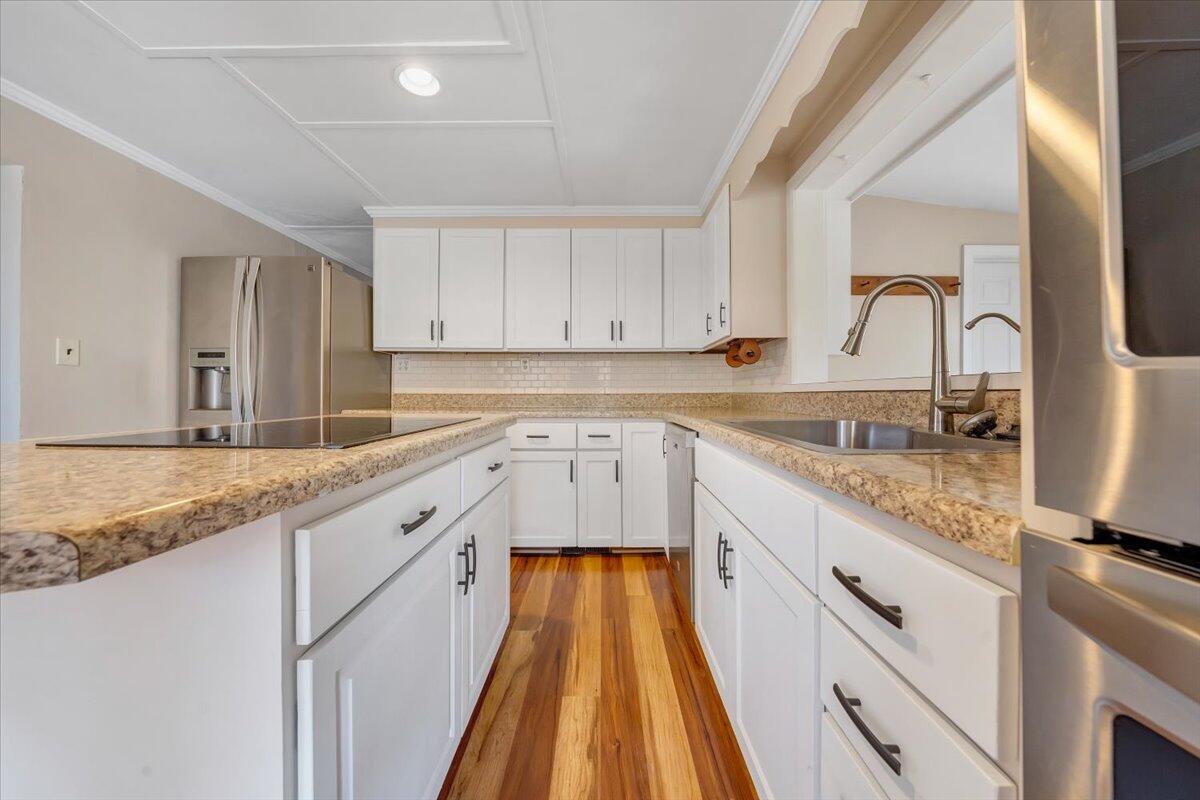 460 Thompson Ridge Road Ferrum, VA 24088 - Photo 16 of 48 a kitchen with granite countertop a sink and cabinets
