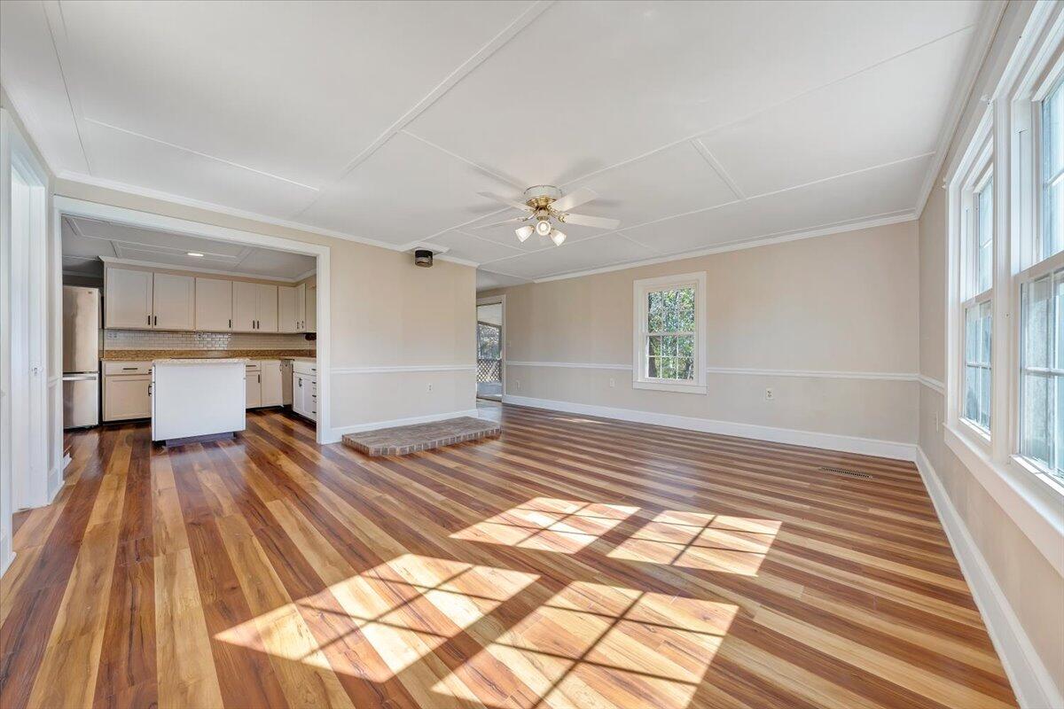 460 Thompson Ridge Road Ferrum, VA 24088 - Photo 17 of 48 a view of a livingroom with wooden floor and a kitchen space
