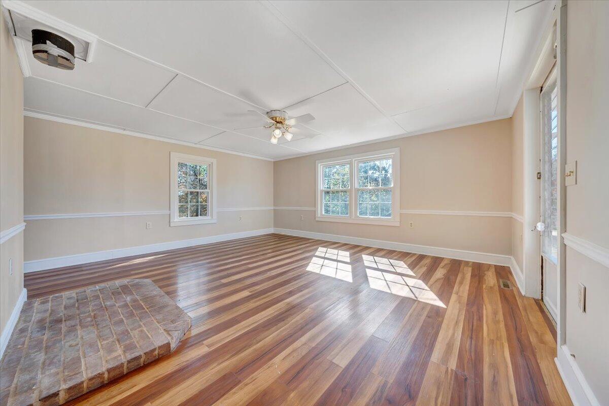 460 Thompson Ridge Road Ferrum, VA 24088 - Photo 18 of 48 a view of an empty room with wooden floor and a window