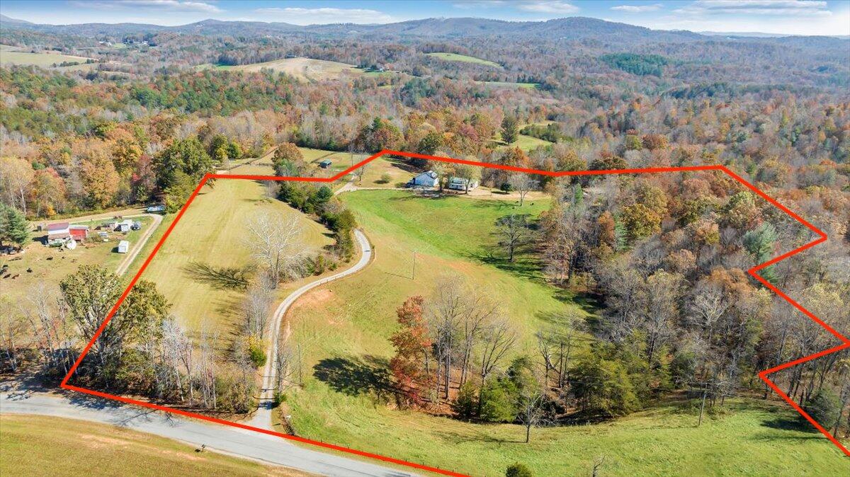 460 Thompson Ridge Road Ferrum, VA 24088 - Photo 2 of 48 an aerial view of a house with a yard and lake view
