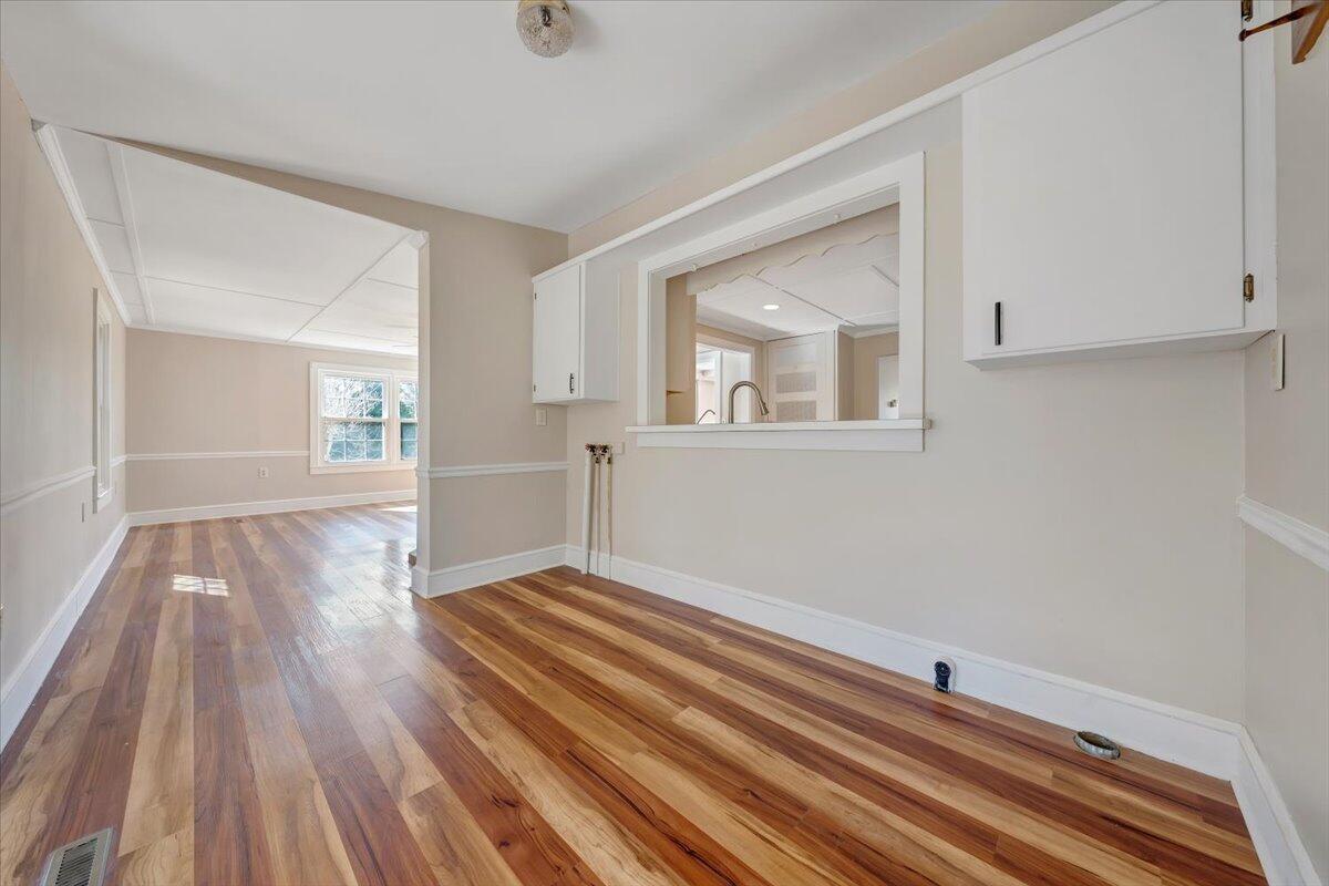 460 Thompson Ridge Road Ferrum, VA 24088 - Photo 21 of 48 a view of an empty room with wooden floor and a window