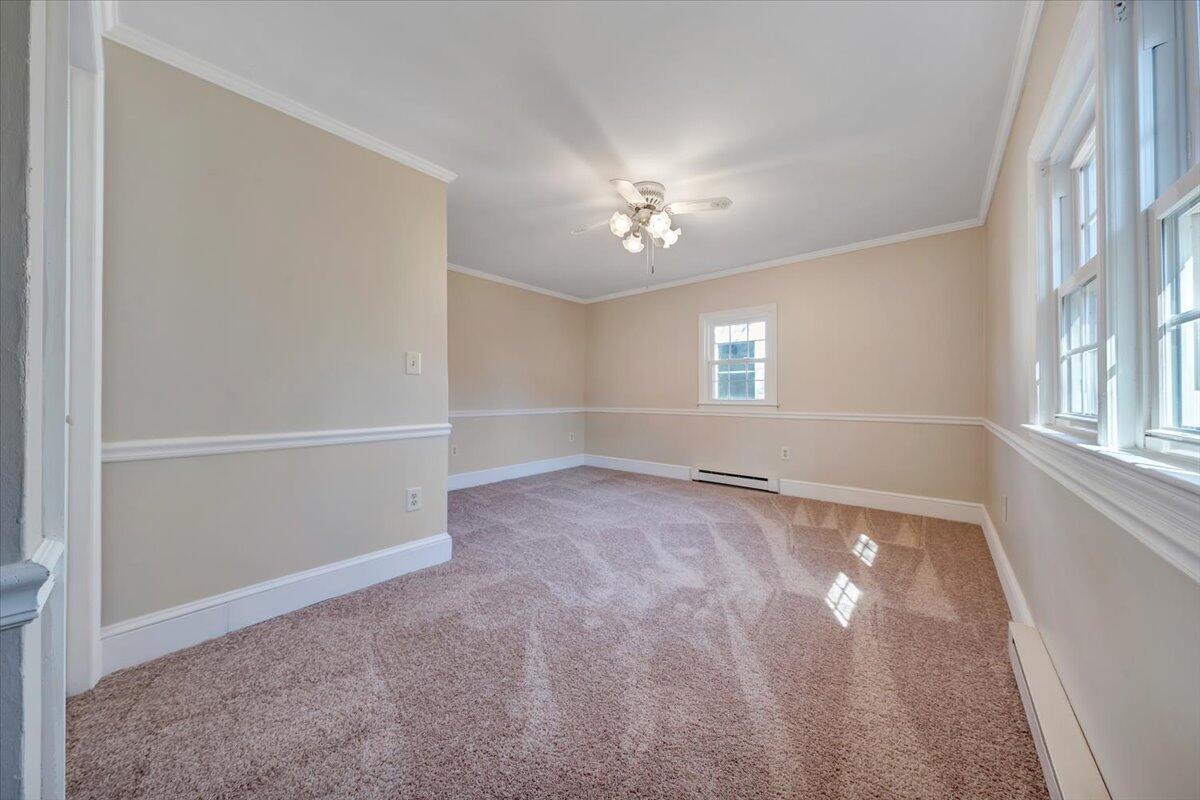 460 Thompson Ridge Road Ferrum, VA 24088 - Photo 25 of 48 an empty room with windows and chandelier fan
