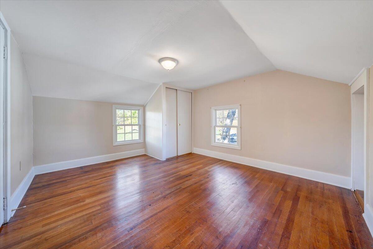 460 Thompson Ridge Road Ferrum, VA 24088 - Photo 30 of 48 an empty room with wooden floor and window