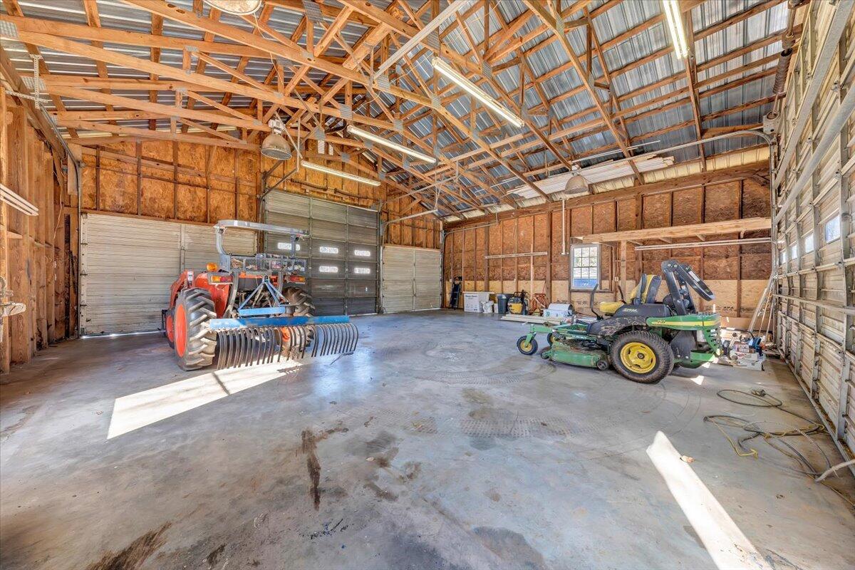 460 Thompson Ridge Road Ferrum, VA 24088 - Photo 39 of 48 a view of garage with a table and a cycle