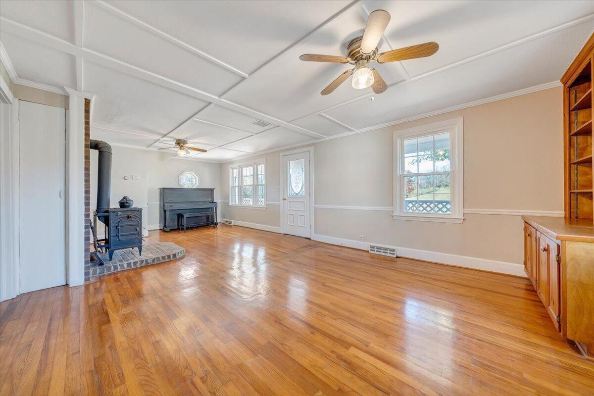 460 Thompson Ridge Road Ferrum, VA 24088 - Photo 10 of 48 a view of empty room with wooden floor and fan
