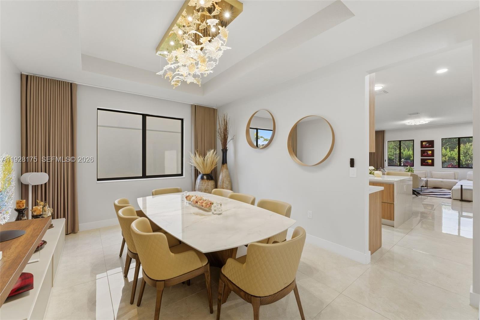 12070 Southwest 83rd Place Miami, FL 33156 - Photo 15 of 42 a view of a dining room with furniture and a chandelier