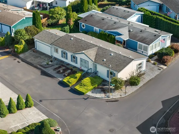 an aerial view of a house with yard swimming pool and outdoor seating