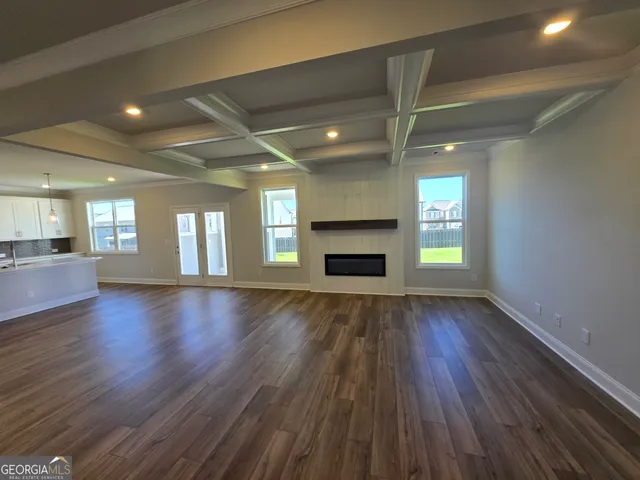 a kitchen with stainless steel appliances a sink a stove a microwave and cabinets