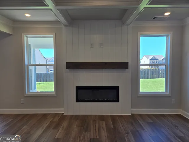a view of a room with an empty space and a porch