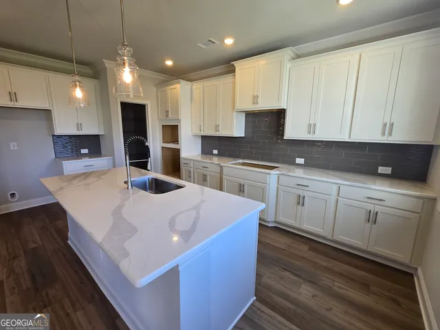 a bathroom with a sink a toilet a mirror and vanity