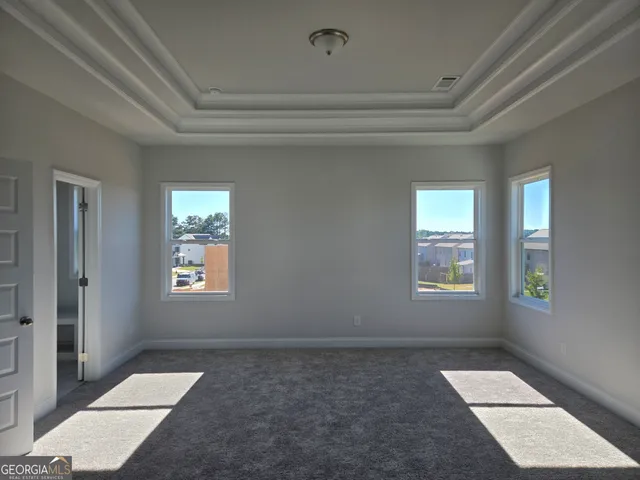 a view of an entryway with wooden floor