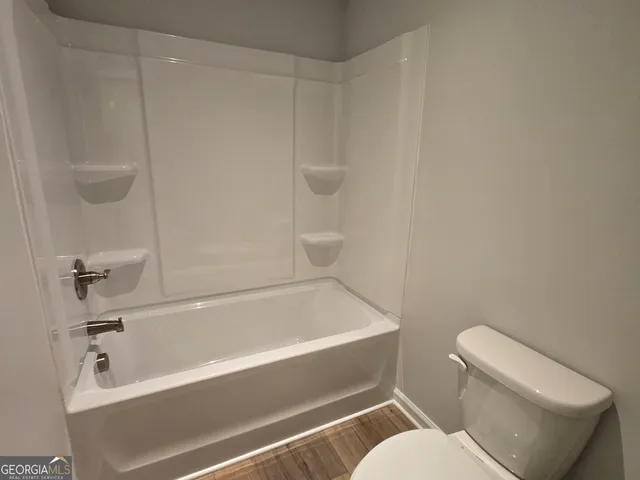 a view of multiple houses with a swimming pool