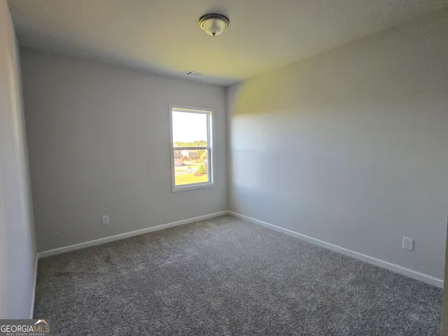 a balcony with view of the house
