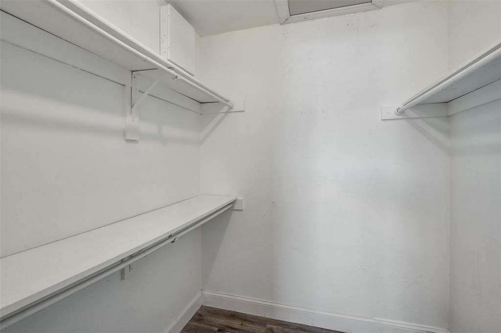2200 East Trinity Mills Road, Unit 206 Carrollton, TX 75006 - Photo 21 of 24 a close up view of racks on the wall