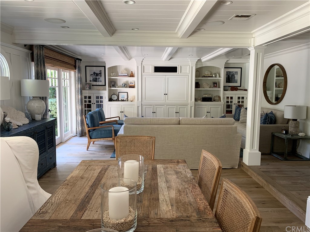 33965 Cape Cove Dana Point, CA 92629 - Photo 20 of 43 a living room with furniture kitchen view and a wooden floor