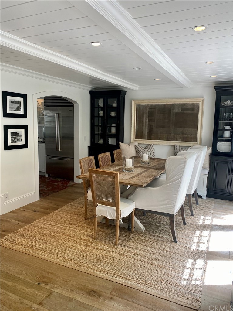 33965 Cape Cove Dana Point, CA 92629 - Photo 21 of 43 a living room with furniture a flat screen tv and a table