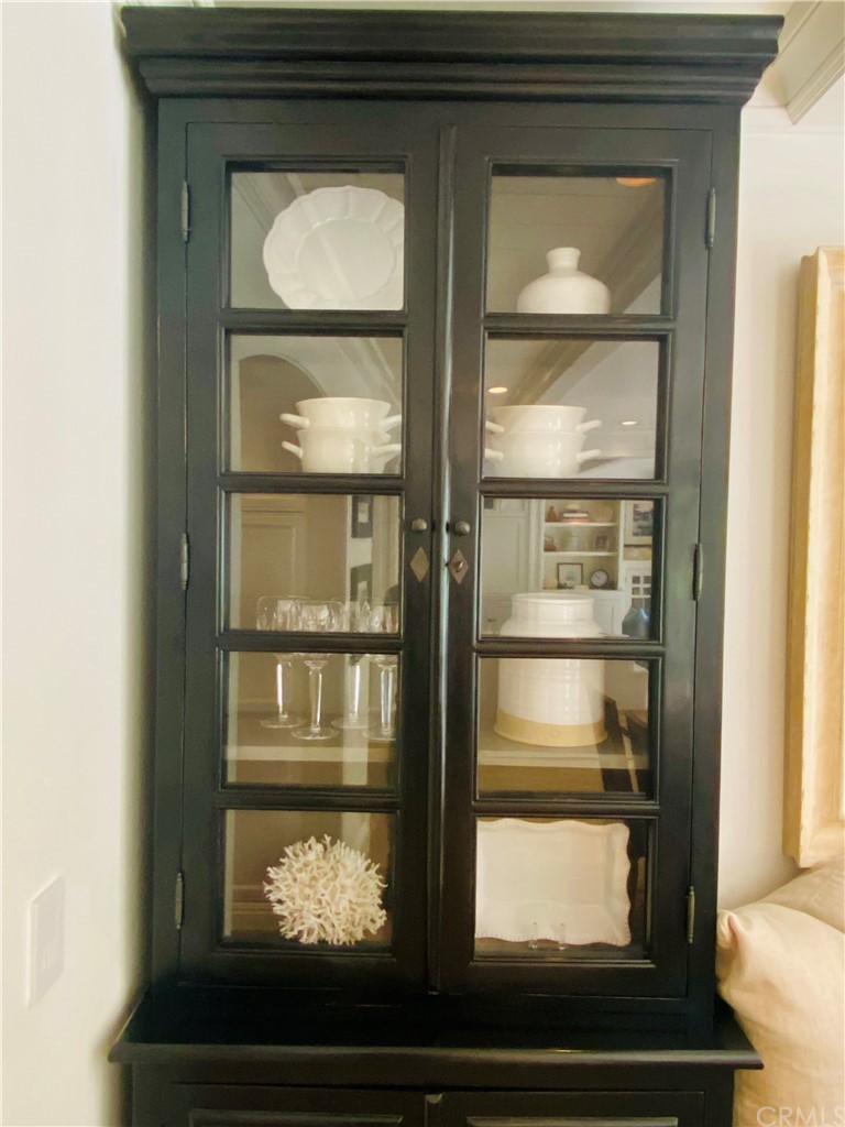 33965 Cape Cove Dana Point, CA 92629 - Photo 22 of 43 a room with a wooden floor and mirror