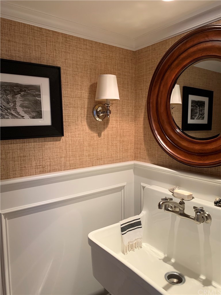 33965 Cape Cove Dana Point, CA 92629 - Photo 24 of 43 a bathroom with a sink and mirror