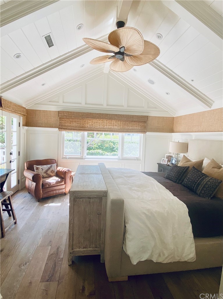 33965 Cape Cove Dana Point, CA 92629 - Photo 26 of 43 a bedroom with a bed and a chandelier