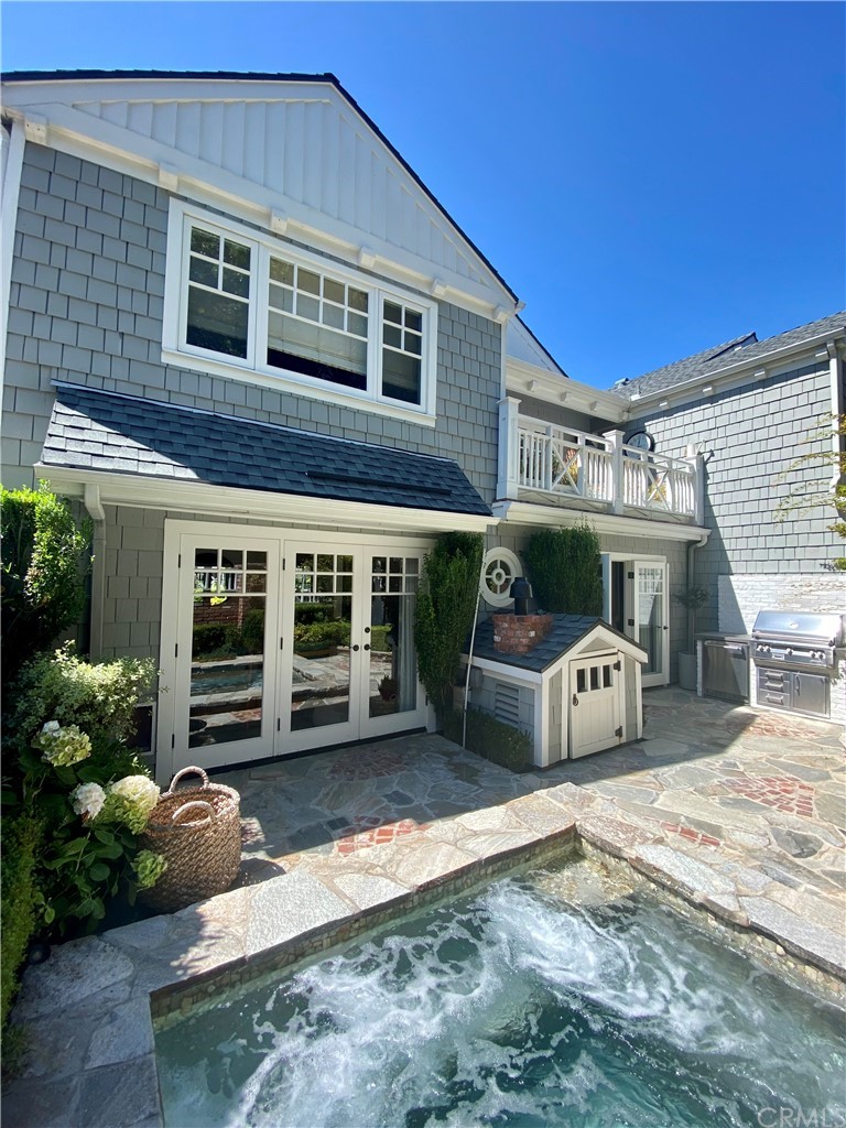 33965 Cape Cove Dana Point, CA 92629 - Photo 3 of 43 a front view of a house with garden and porch