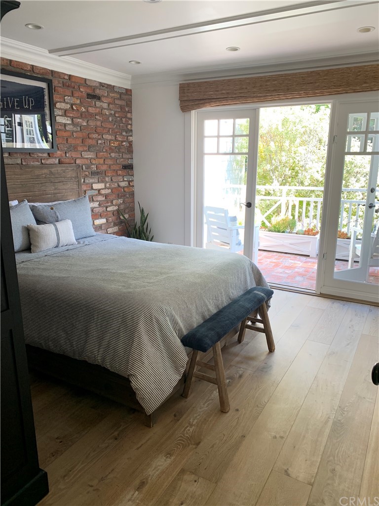 33965 Cape Cove Dana Point, CA 92629 - Photo 31 of 43 a bedroom with a bed and a window