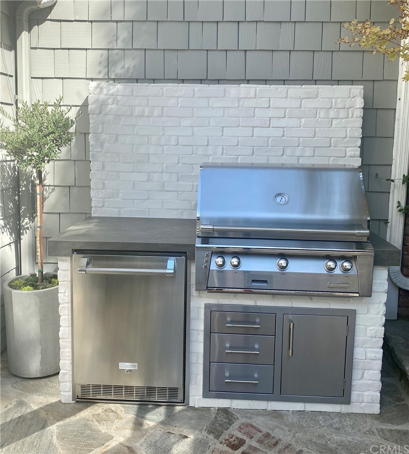 33965 Cape Cove Dana Point, CA 92629 - Photo 36 of 43 a stove top oven sitting inside of a kitchen